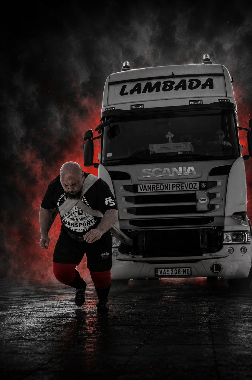 Vlad sprinting to pull a Scania truck during a strongman exhibition